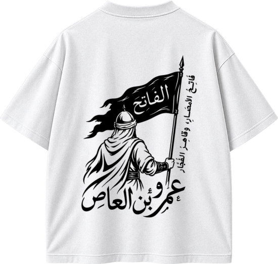 White short-sleeve T-shirt shown from the back, featuring a large black graphic print of a robed figure holding a flag with Arabic text.