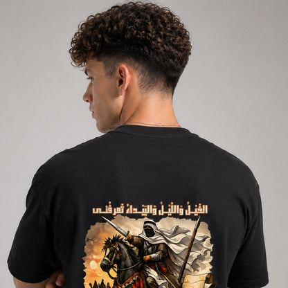 Person wearing a black t-shirt with a graphic design on the back, featuring a warrior on horseback.