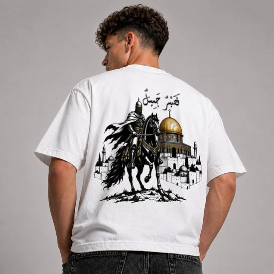 Person wearing a white t-shirt with a graphic design on the back, featuring a horse and architectural elements.