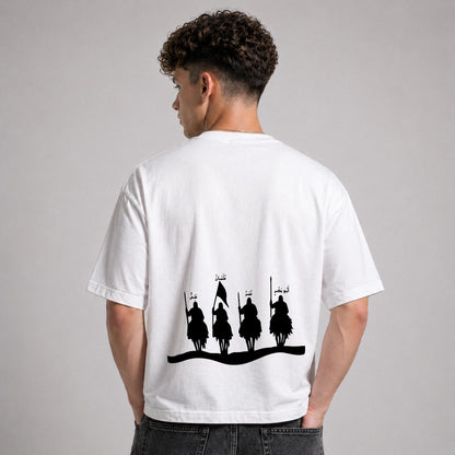 Person wearing a white t-shirt with black graphic design on the back against a gray background