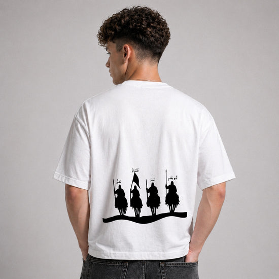 Person wearing a white t-shirt with black graphic design on the back against a gray background