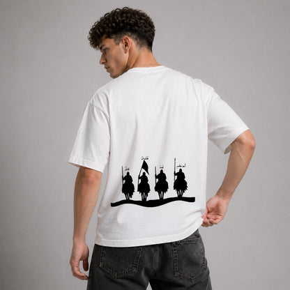 Person wearing a white t-shirt with black graphic design on the back against a gray background
