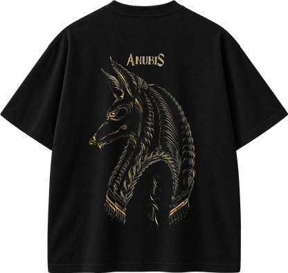 A black short-sleeve t-shirt shown from the back, featuring a large gold graphic of the Anubis horse head and the word 'ANUBIS' printed in gold above it, set against a plain white background.