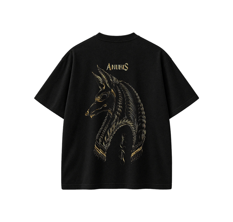 A black short-sleeve t-shirt shown from the back, featuring a large gold graphic of the Anubis horse head and the word 'ANUBIS' printed in gold above it, set against a plain white background.