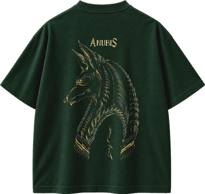 A dark forest green short-sleeve t-shirt shown from the back, featuring a large gold graphic of an Anubis horse head and the word 'ANUBIS' printed in gold above it.