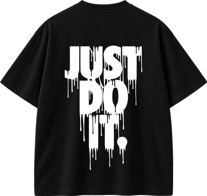 A black short-sleeve t-shirt with a large white dripping graphic text reading 'JUST DO IT.' on the front, shown against a plain white background.