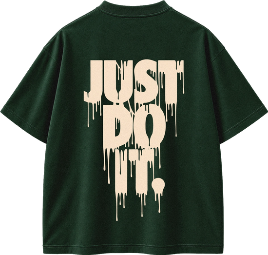 A dark forest green short-sleeve t-shirt shown from the back, featuring a large cream-colored dripping text graphic that reads 'JUST DO IT.' on the back.