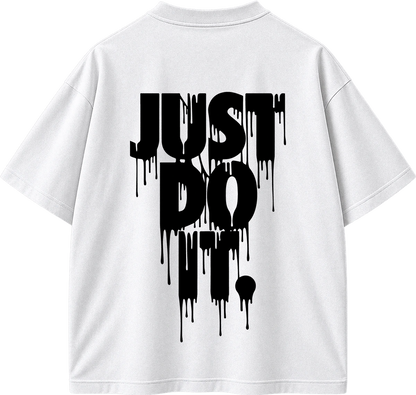 White short-sleeve T-shirt shown from the back with a large black dripping text graphic reading 'JUST DO IT.' on a plain white background.