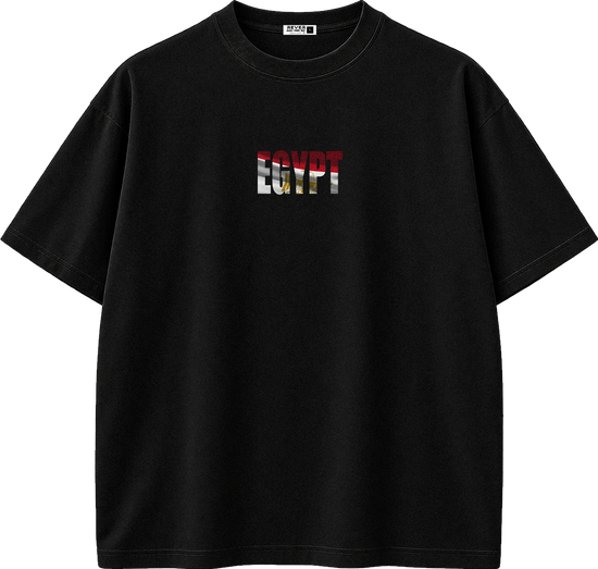 A black short-sleeve crewneck t-shirt featuring a chest graphic that reads 'EGYPT' in a distressed flag pattern of red, white, black, and gold. The shirt is displayed flat against a solid white background.