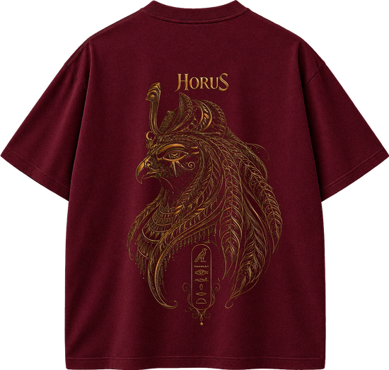 A maroon short-sleeve t-shirt with a large back graphic featuring a detailed gold Egyptian falcon illustration and the word 'HORUS' printed above it.