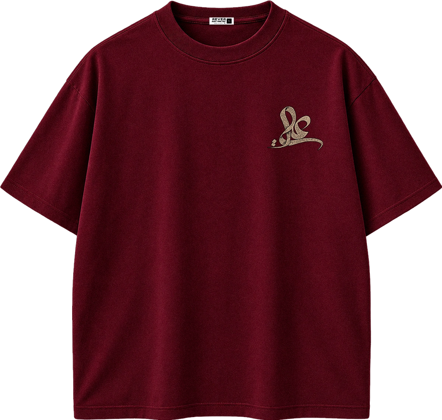 A dark burgundy short-sleeve t-shirt with a small beige embroidered graphic on the left chest, displayed on a clean white background.