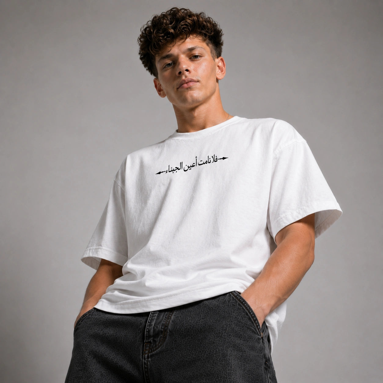 Person wearing a black shirt with a neutral background