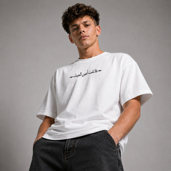 Person wearing a black shirt with a neutral background