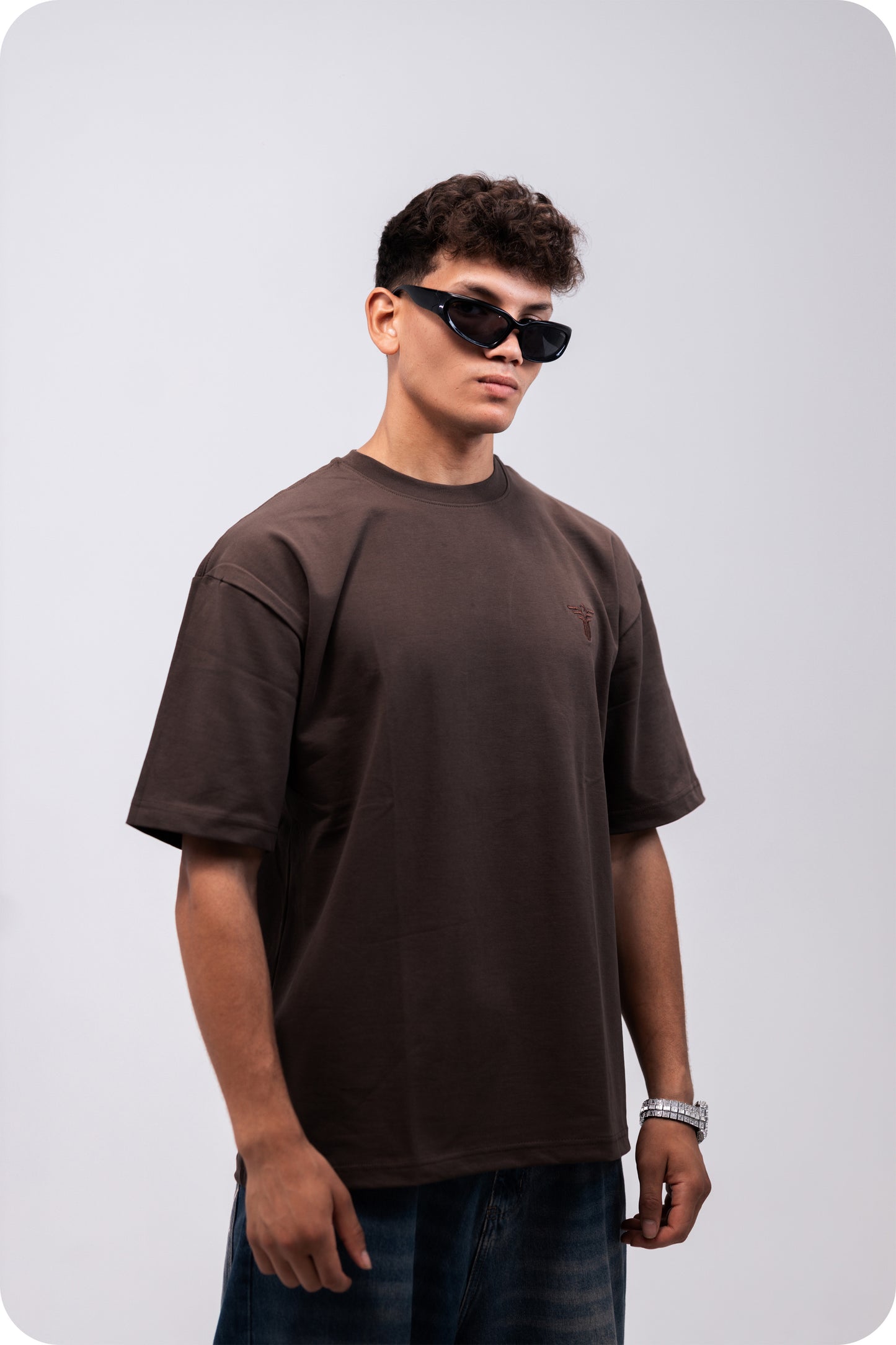 REVER brown plain oversized t-shirt shown from the back with clean, minimal design