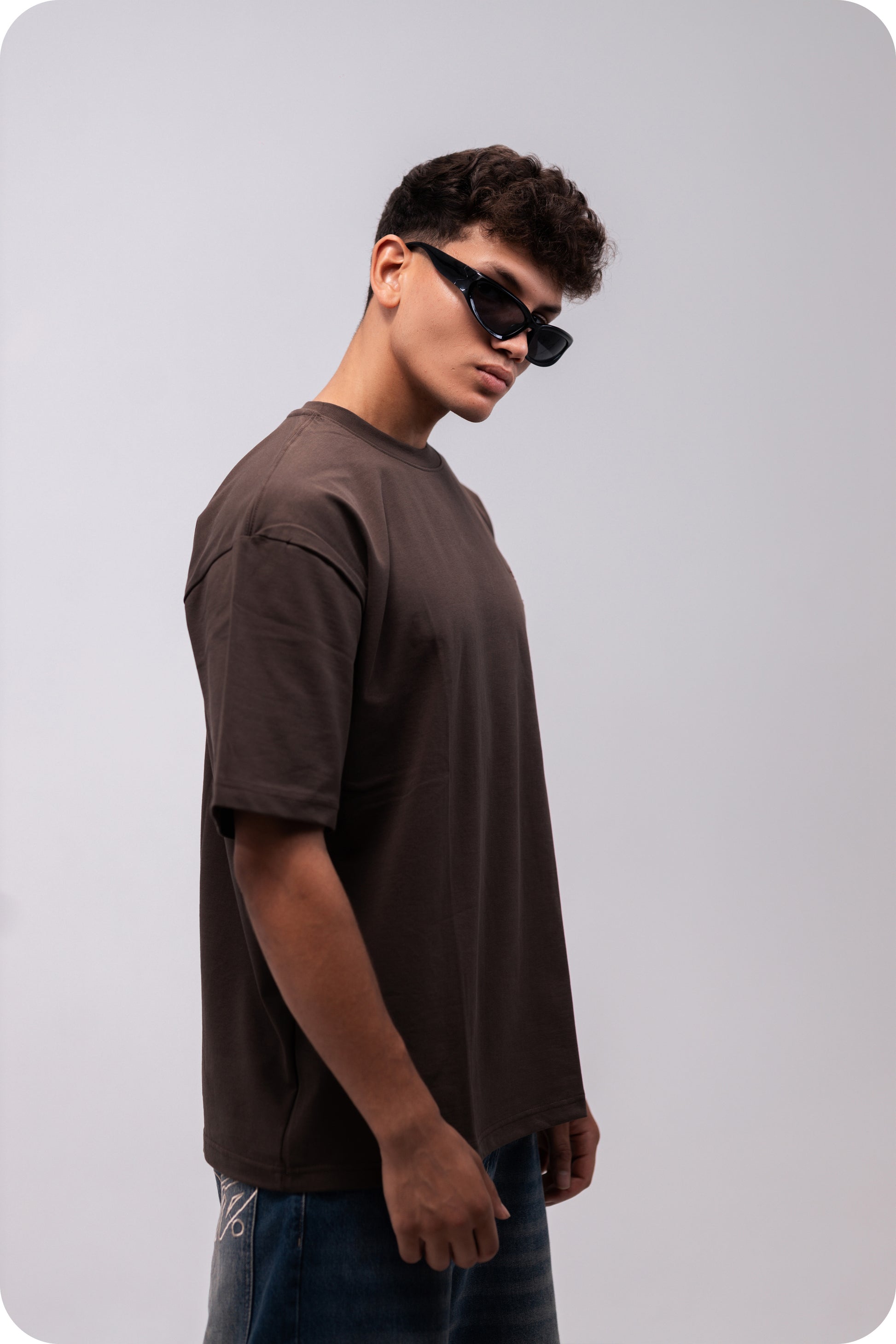 REVER brown plain oversized t-shirt shown from the back with clean, minimal design