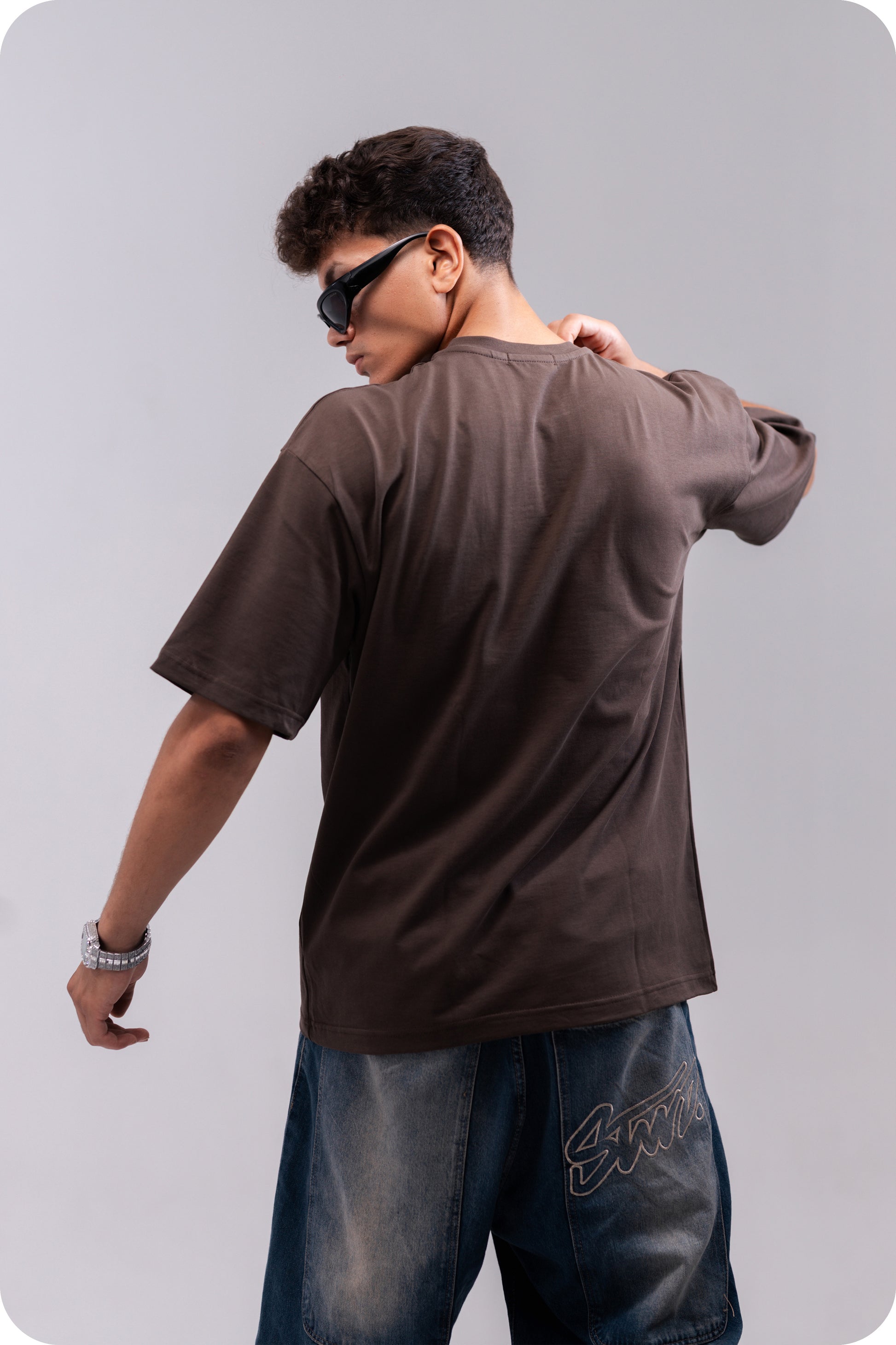 REVER brown plain oversized t-shirt shown from the back with clean, minimal design