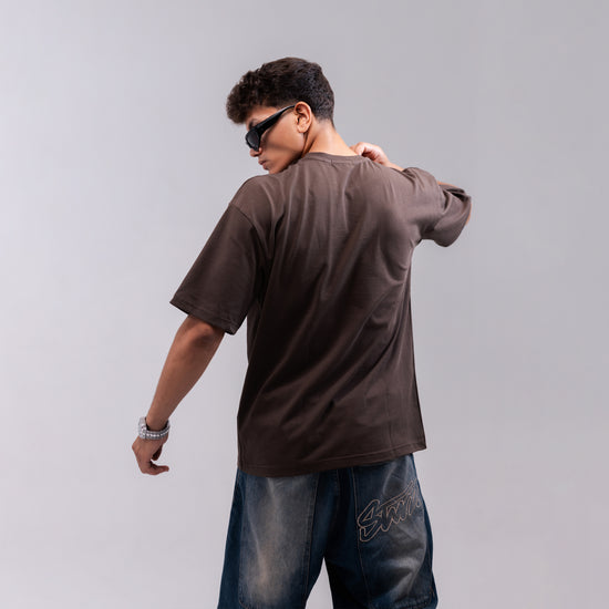 REVER brown plain oversized t-shirt shown from the back with clean, minimal design