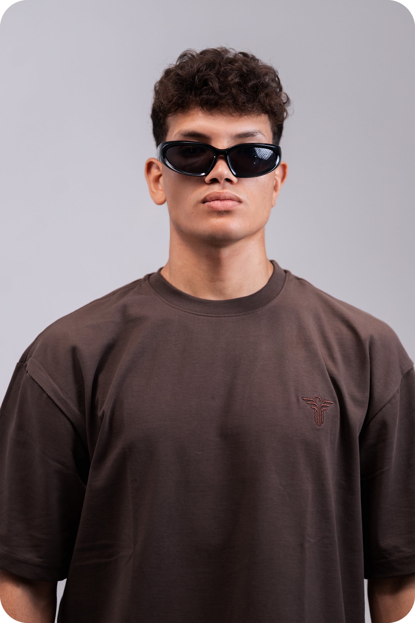 REVER brown plain oversized t-shirt shown from the back with clean, minimal design