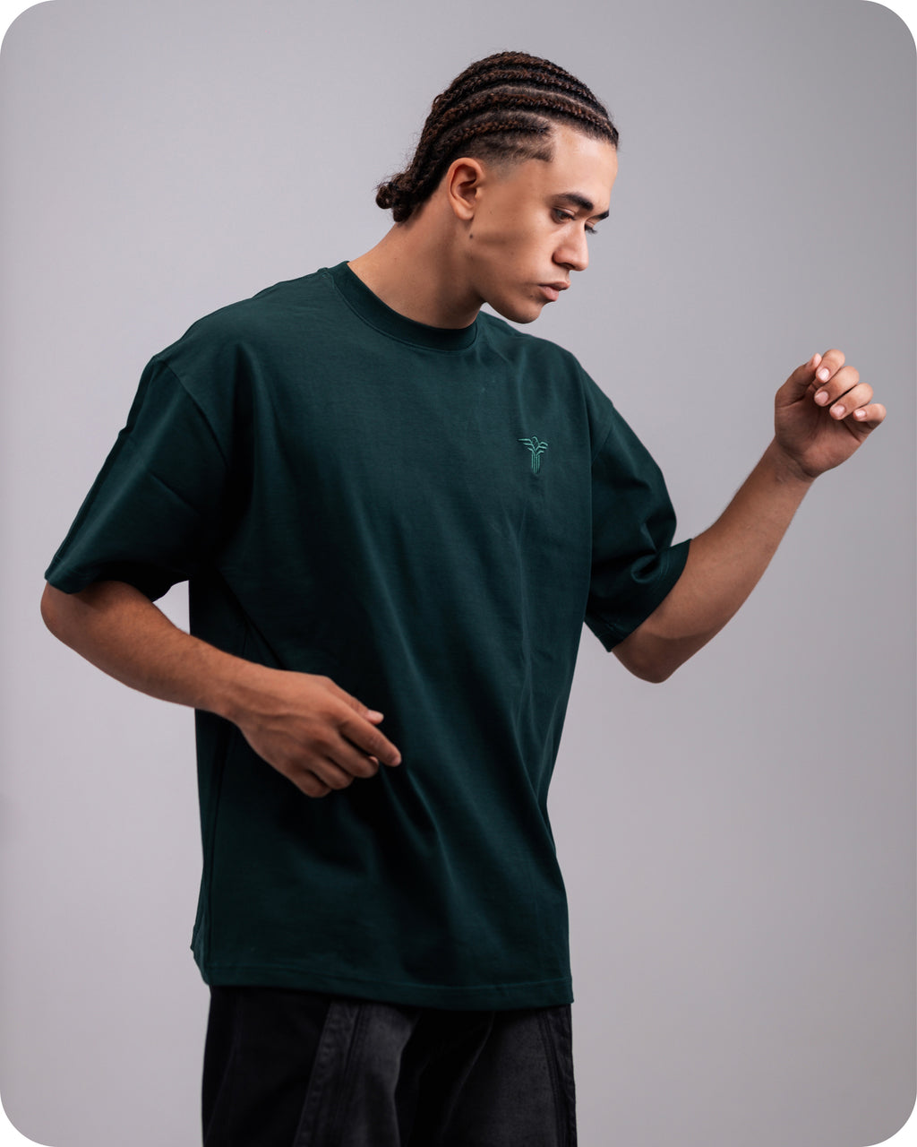 REVER dark-green oversized plain t-shirt side profile highlighting loose fit and minimal cut.