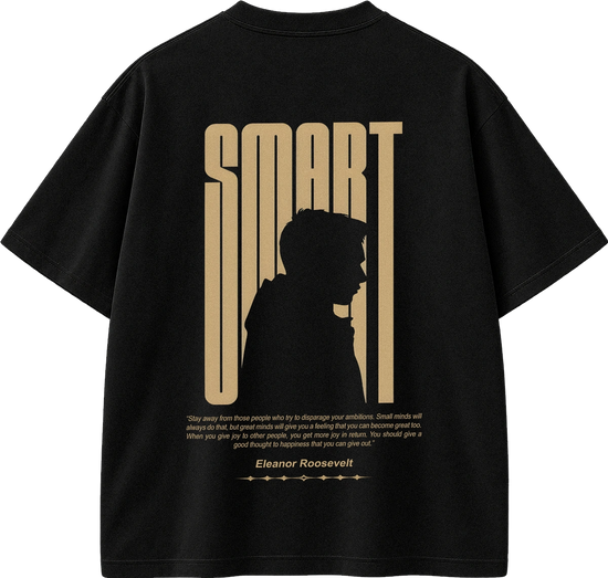 Black short-sleeve t-shirt shown from the back, featuring a large tan graphic with the word 'SMART' in a vertical stylized font, a silhouette profile, a quote attributed to Eleanor Roosevelt, and smaller text below.
