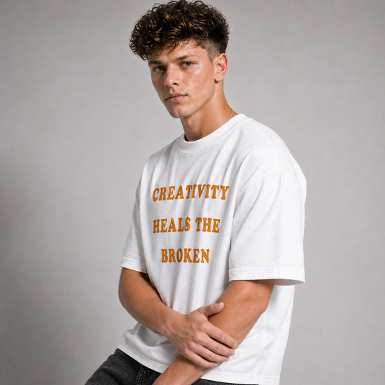 Person wearing a white t-shirt with text on a gray background