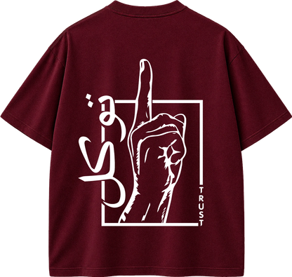 A maroon short-sleeve t-shirt shown from the back, featuring a large white graphic print of a hand raising its middle finger inside a square outline, with stylized text and the word 'TRUST' printed vertically.