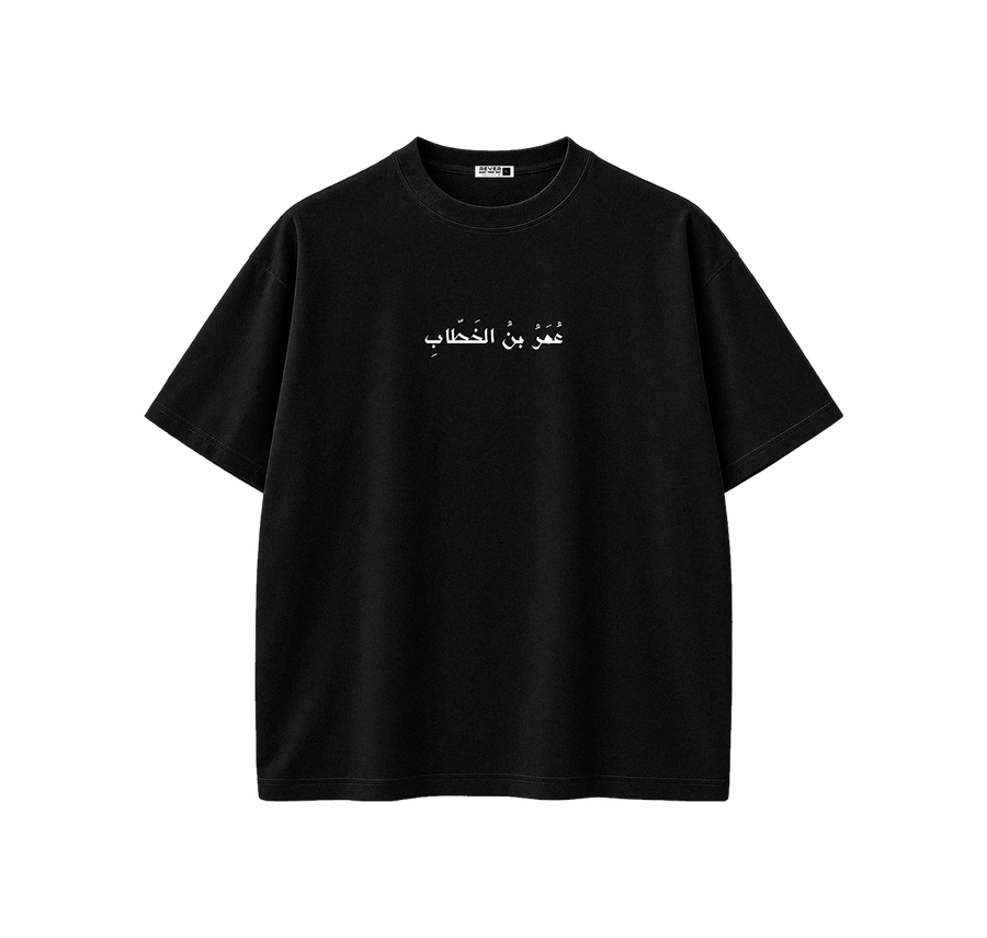 A black short-sleeve crewneck t-shirt with white Arabic text printed across the chest, displayed on a clean white background.
