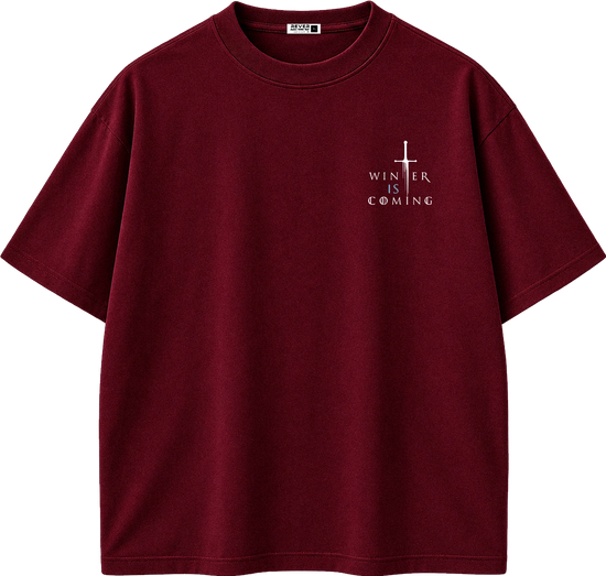 A dark red short-sleeve crewneck t-shirt with a small white graphic on the left chest featuring a cross and the text 'WINTER IS COMING'.