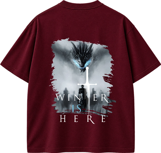 A maroon short-sleeve t-shirt shown from the back, featuring a large graphic print of a dragon, a white sword, and the text 'WINTER IS HERE' in white and light blue.