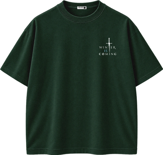 A dark forest green short-sleeve t-shirt with a small white graphic on the left chest featuring a cross and the text 'WINTER IS COMING'.
