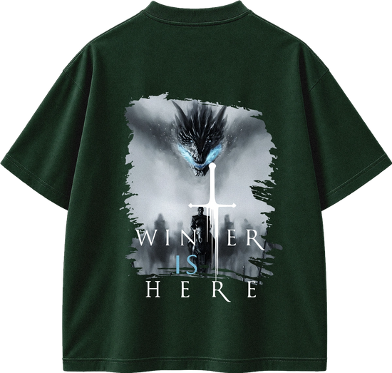 A black short-sleeve t-shirt with a large graphic print on the back. The graphic features a dark dragon with glowing blue eyes above a silhouette of a person holding a sword, with the text 'WINNER IS HERE' written below in white and light blue.