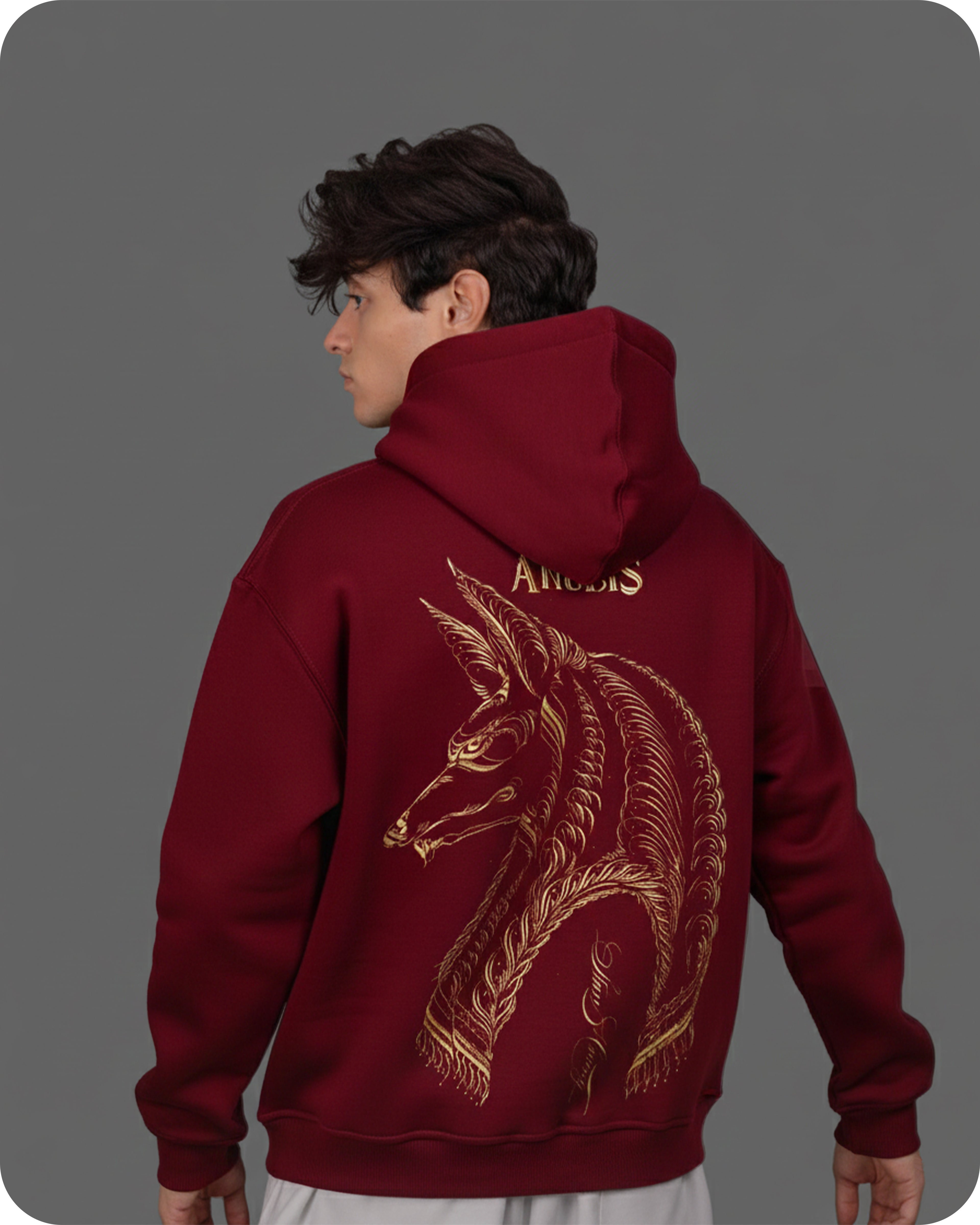 Person wearing a maroon hoodie with a dragon design and 'Angels' text on the back, against a gray background.