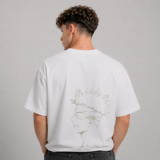 Person wearing a white t-shirt with a graphic design on the back against a gray background