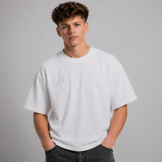 Man wearing a white t-shirt with a small design on a gray background