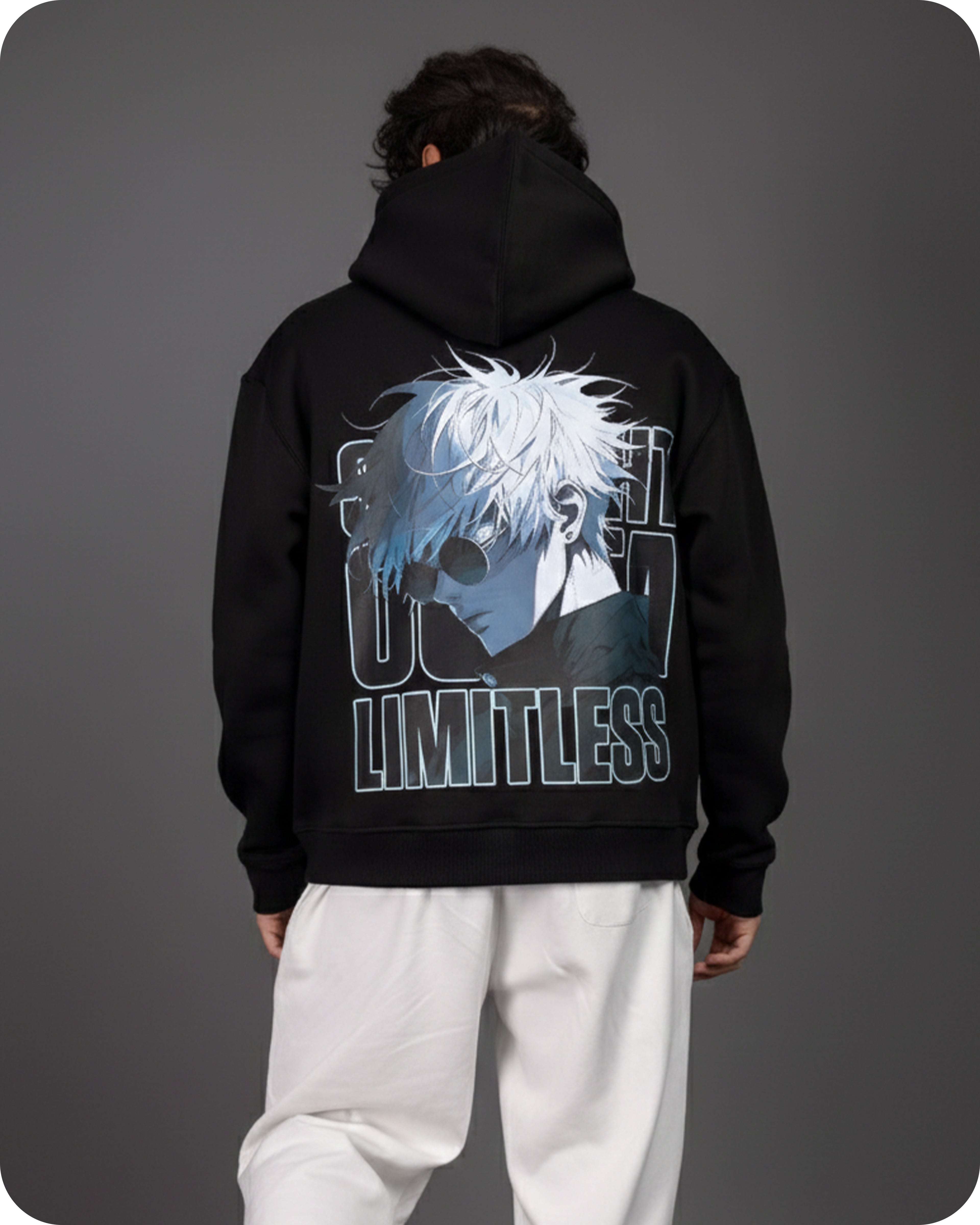 Person wearing a black hoodie with a graphic design on the back against a gray background