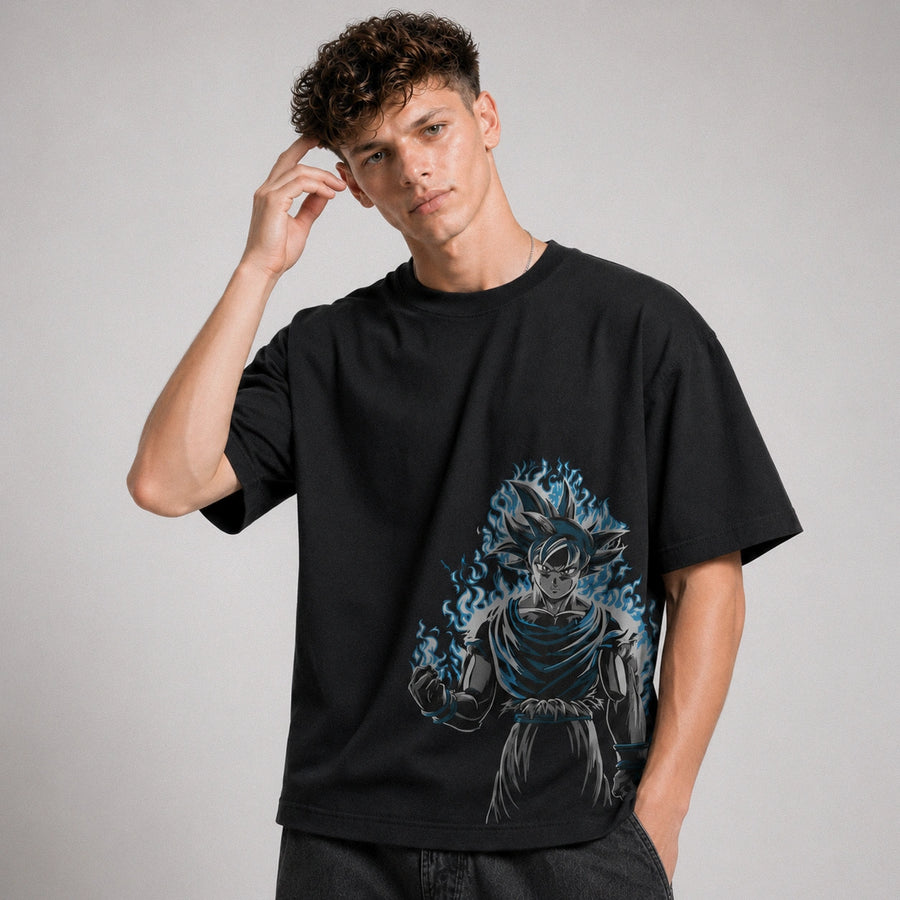 Person wearing a black t-shirt with a graphic design on a plain background