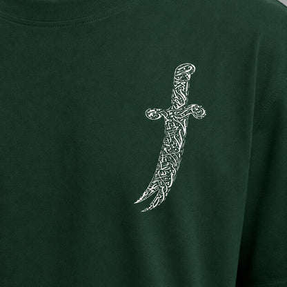 Green t-shirt with a white dagger design on a plain background
