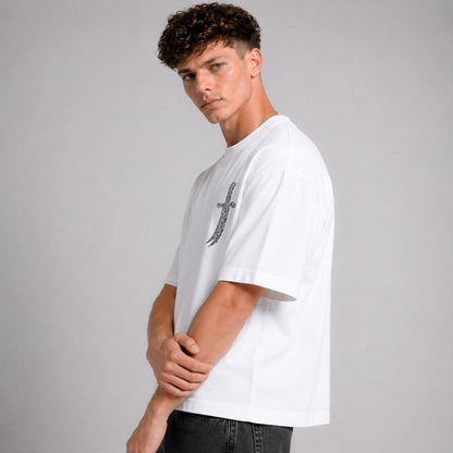 Man wearing a white t-shirt with a black graphic design on a gray background