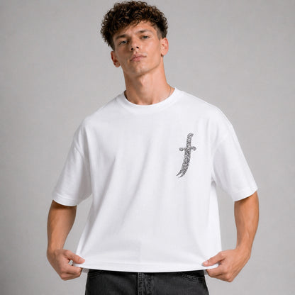 Man wearing a white t-shirt with a graphic design on a gray background