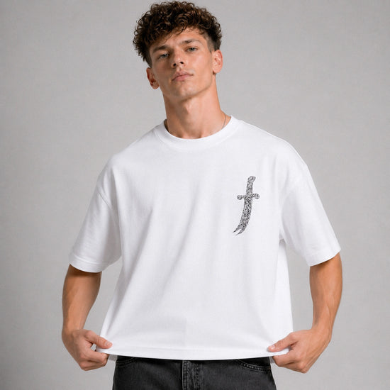 Man wearing a white t-shirt with a graphic design on a gray background