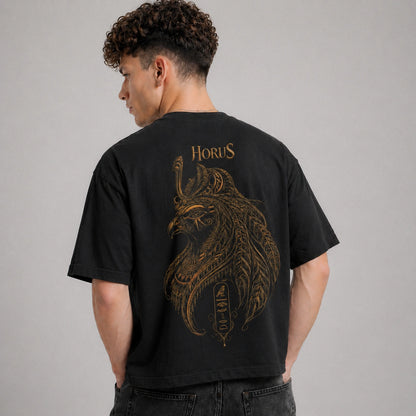 Person wearing a black t-shirt with a gold lion design and 'Horus' text on the back.