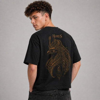 Man wearing a black t-shirt with 'Horus' design on the back against a gray background