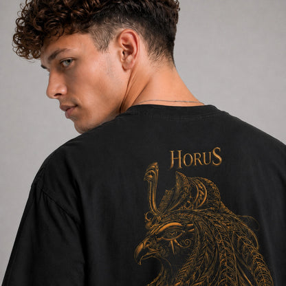 Person wearing a black t-shirt with 'Horus' design on the back against a gray background