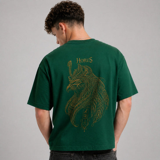 Person wearing a green t-shirt with a lion design and 'Horus' text on the back, against a gray background.