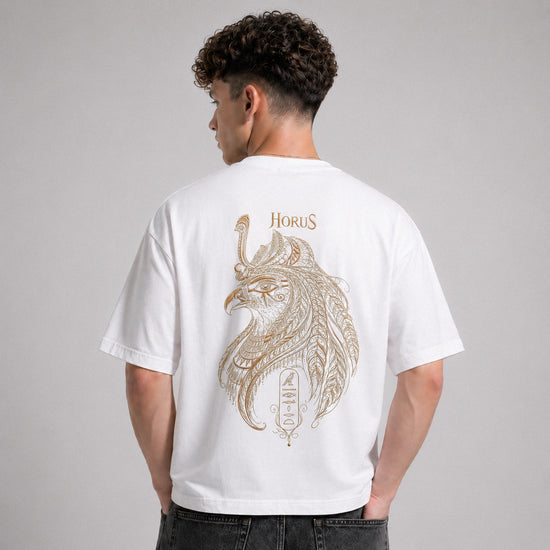 Person wearing a white t-shirt with a gold 'Horus' design on the back against a gray background
