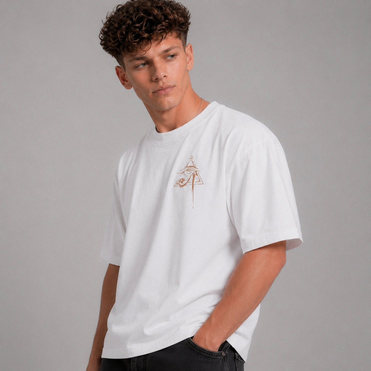 Man wearing a white t-shirt with a small logo on a gray background