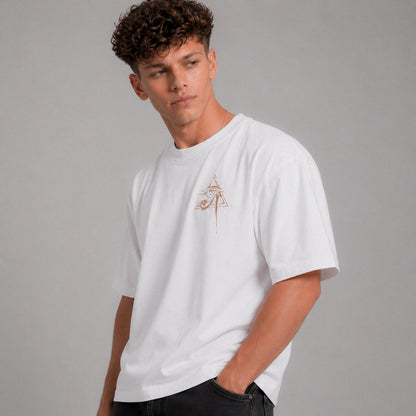 Man wearing a white t-shirt with a small logo on a gray background