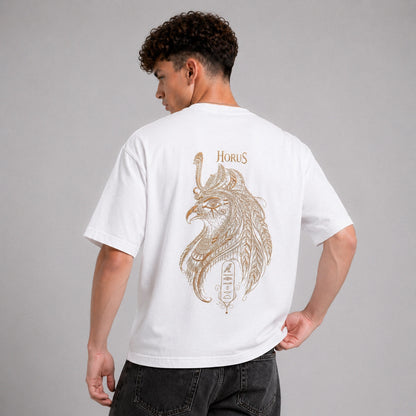 Person wearing a white t-shirt with a detailed design and 'Horus' text on the back, standing against a gray background.