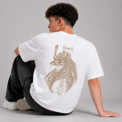 Person wearing a white t-shirt with 'Horus' design on the back, sitting against a gray background