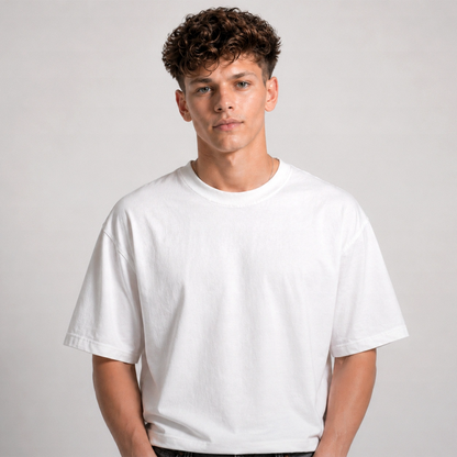Person wearing a plain white t-shirt against a light gray background